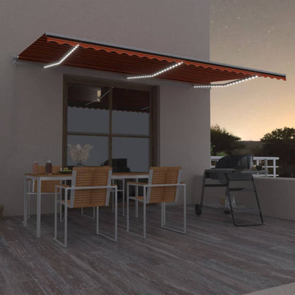 Markis manuellt infällbar med LED 600x300 cm orange och brun