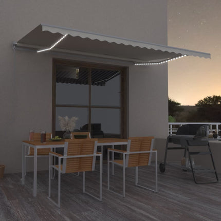 Markis manuellt infällbar med LED 500x350 cm gräddvit