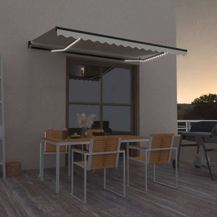 Markis manuellt infällbar med LED 450x300 cm gräddvit