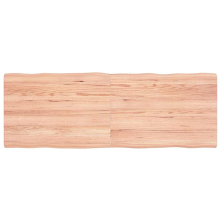 Bordsskiva ljusbrun 140x50x(2-4) cm massivt trä levande kant