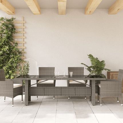 Trädgårdsbord med glasskiva grå 240x90x75 cm konstrotting