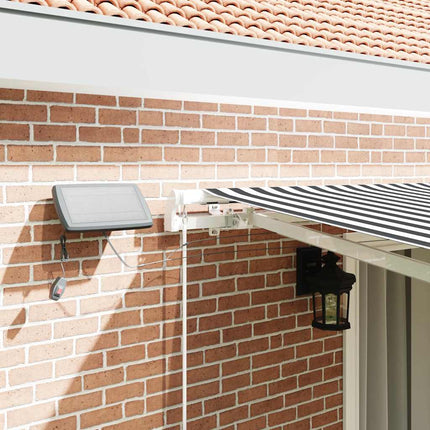 Markis manuellt infällbar med LEDs antracit och vit 450x300 cm