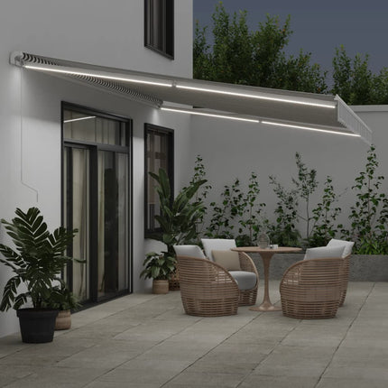 Markis manuellt infällbar med LEDs antracit och vit 600x350 cm