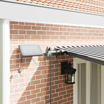 Markis manuellt infällbar med LEDs antracit och vit 600x300 cm