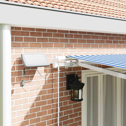 Utfällbar markis med LED -remsljus Blå och Vit 600 × 300 cm